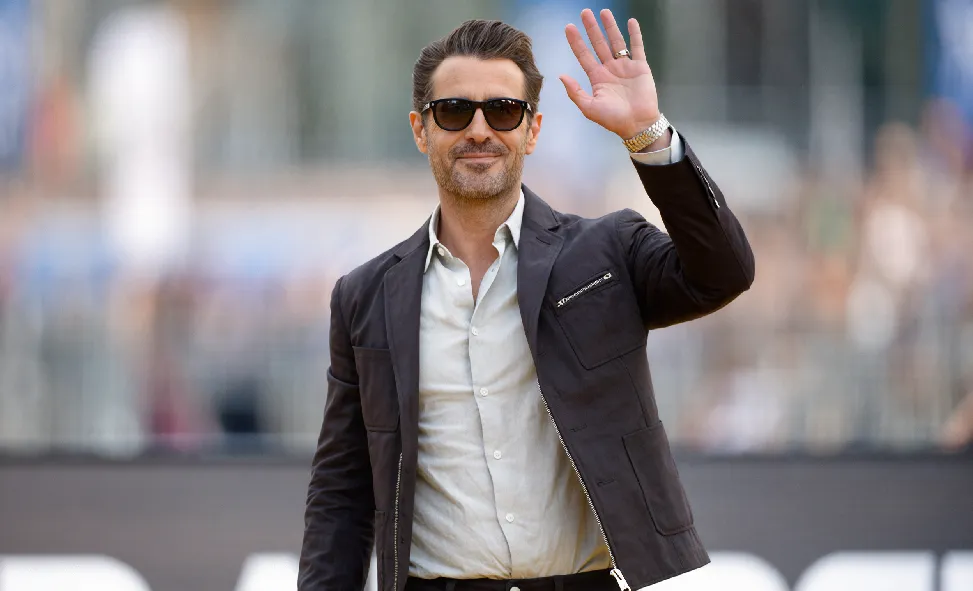 Corey Feldman smiling and waving at a recent public appearance creating social media buzz